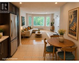 A modern kitchen with a dining table set up.