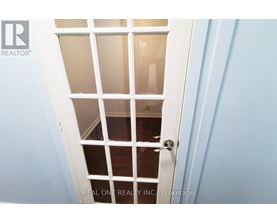A white door with a glass window in the middle.