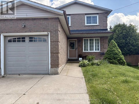 A house with a grey garage door is for sale.
