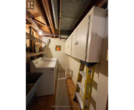 A laundry room with a washer and dryer.