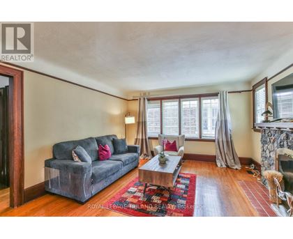 A living room with a grey couch and a coffee table.