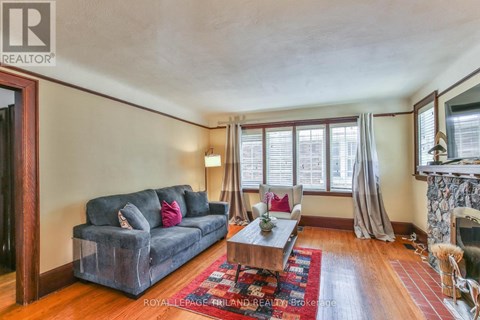 A living room with a grey couch and a coffee table.