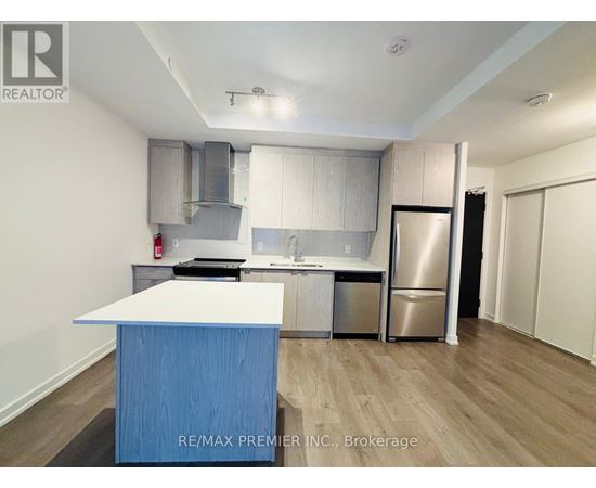 A kitchen with a blue island in the middle.