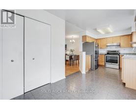 A realtor photo of a kitchen with a dining table and chairs.