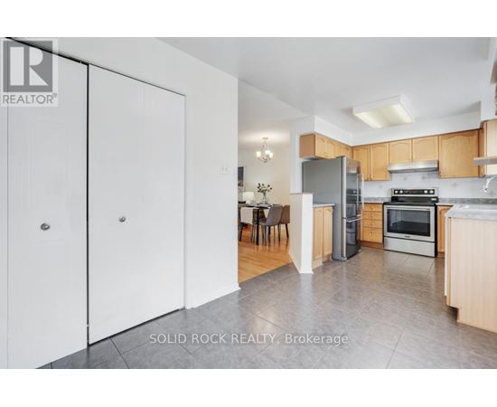 A realtor photo of a kitchen with a dining table and chairs.
