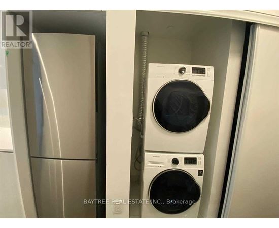 A washer and dryer are in a small space.