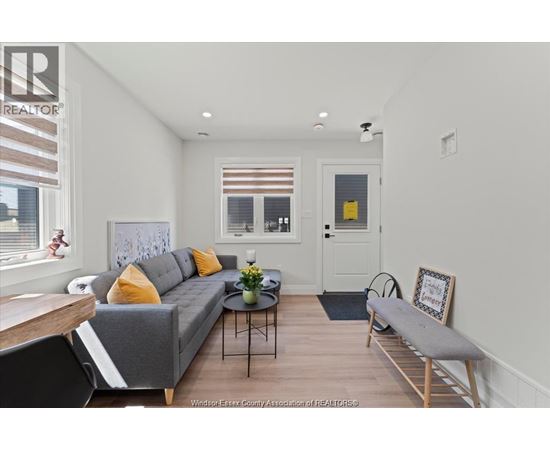 A living room with a grey couch and a coffee table.