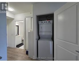 A white oven and fridge in a kitchen.