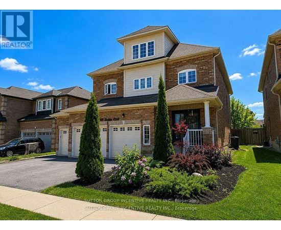 A large house with a driveway and landscaping in front.