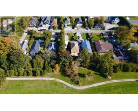 A residential area with houses and trees.