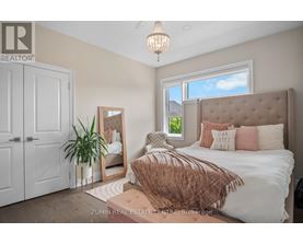 A bedroom with a large bed and a mirror on the wall.