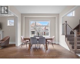 A dining room with a table set for four.