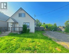 A house with a yard is for sale.