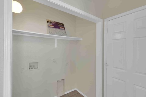 A white shelf with a box on it in a room.