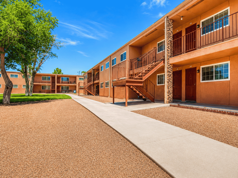 A sunny day at the apartment complex with a clear blue sky.