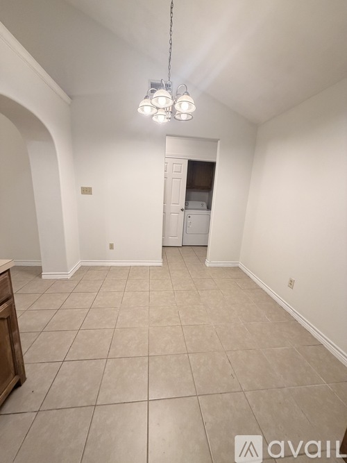 A room with a white wall and a white door.