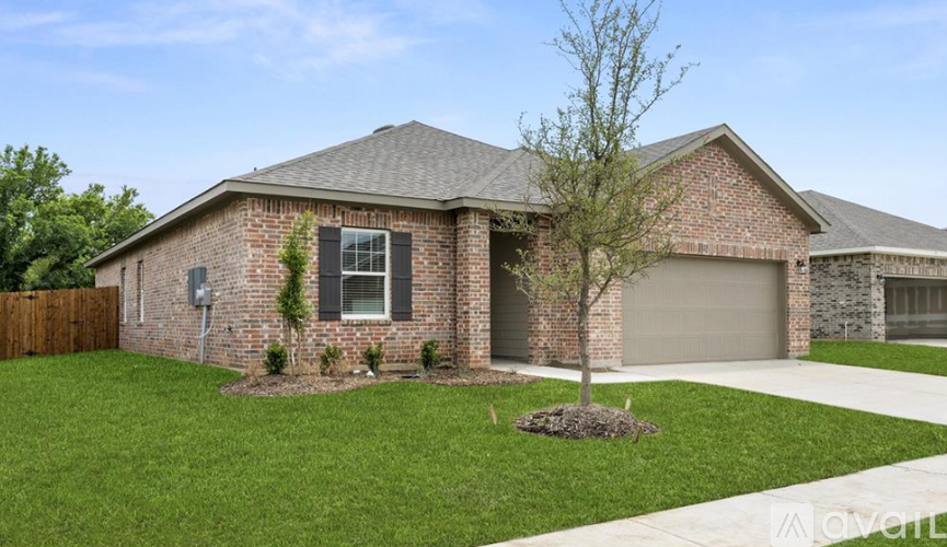 A house with a brick facade and a grey roof.