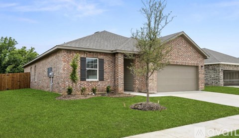 A house with a brick facade and a grey roof.
