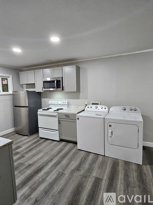 A laundry room with a washer and dryer set up.