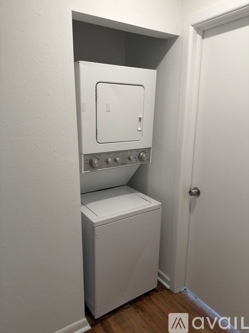 A white oven and dishwasher in a small kitchen.