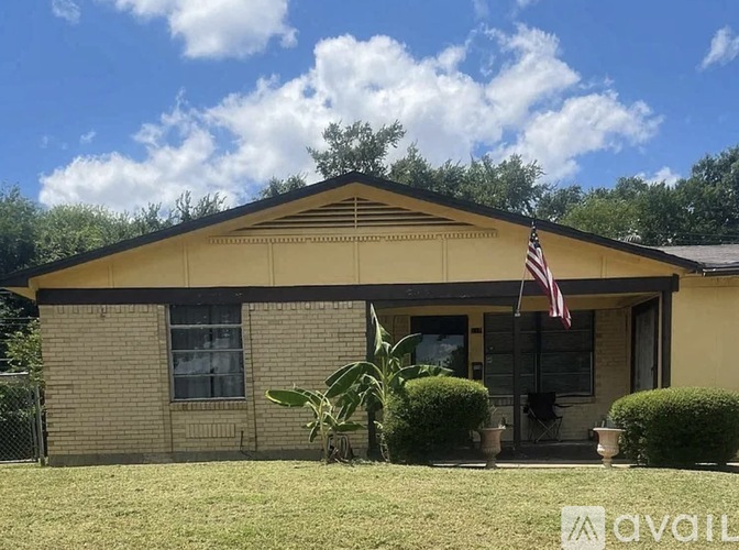 A house with a flag on the front porch.