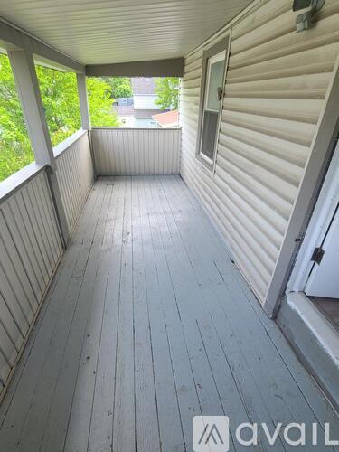 A balcony with a sliding door and a window.