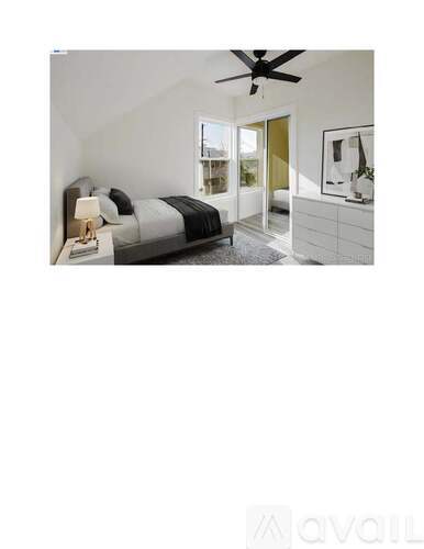 A bedroom with a bed, dresser, and a ceiling fan.