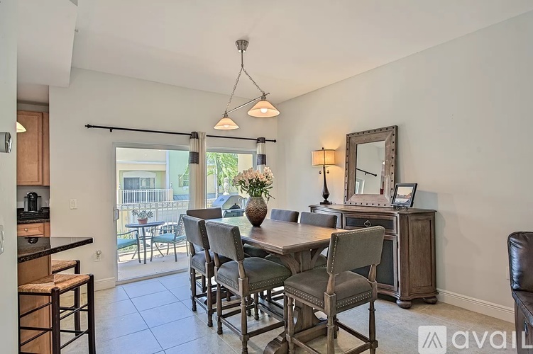 A dining room with a table set for six.
