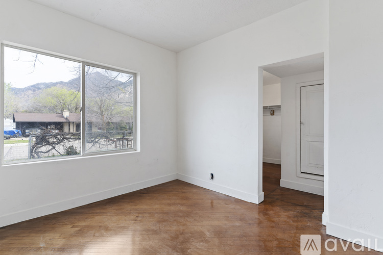 Empty room with a view of the outdoors through the window.