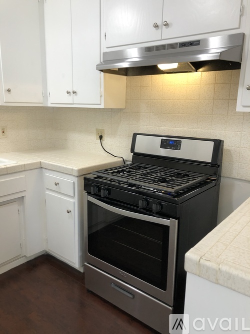 A kitchen with a stove and oven.