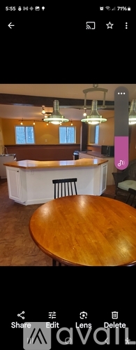 A wooden table is in the foreground with a white curtain backdrop.