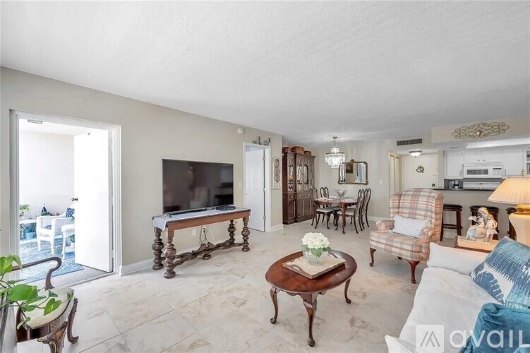 A living room with a wooden coffee table and a couch.