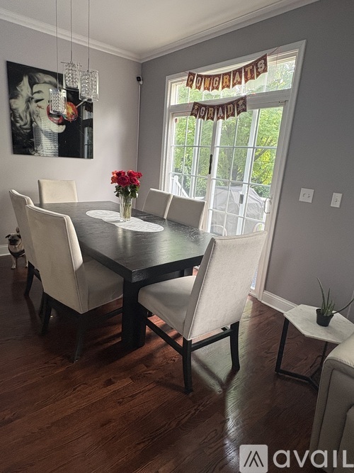 A dining room with a table, chairs, and a sign that says "HONORARIES".