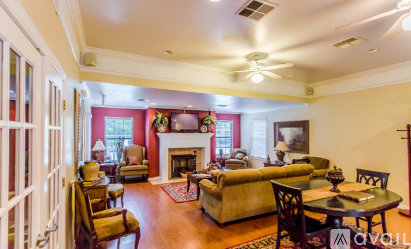 A living room with a fireplace and a couch.