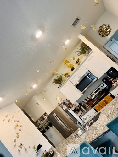 A kitchen with a counter and a sink.