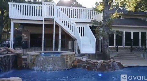 A house with a pool and a deck.