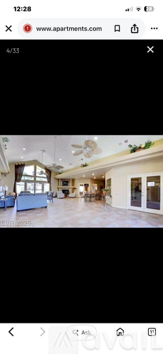 A spacious living room with a sofa set and a coffee table.