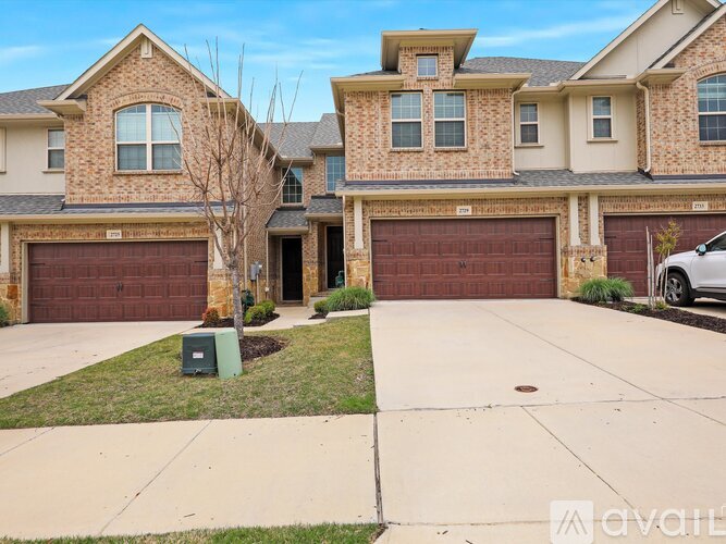 A house with a brown garage door is for sale.