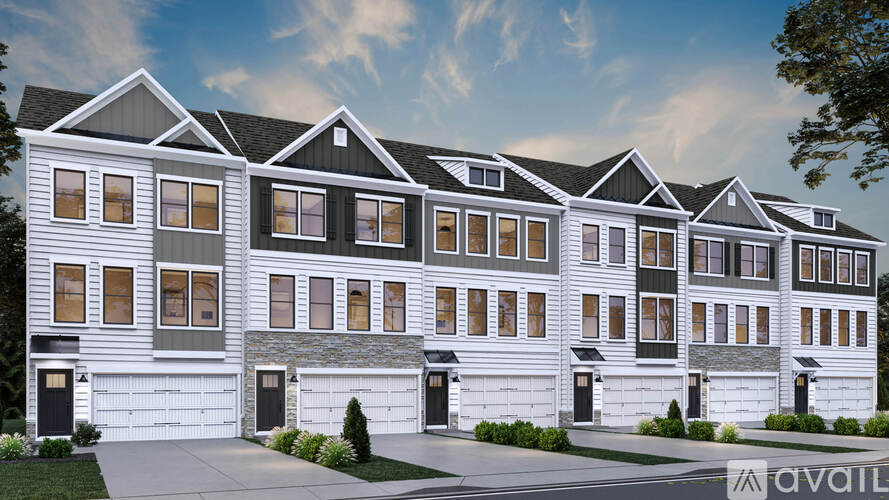 A row of houses with the first one having a stone base.