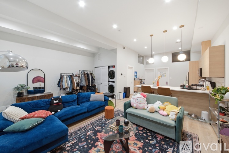 A living room with a blue couch and a coffee table.