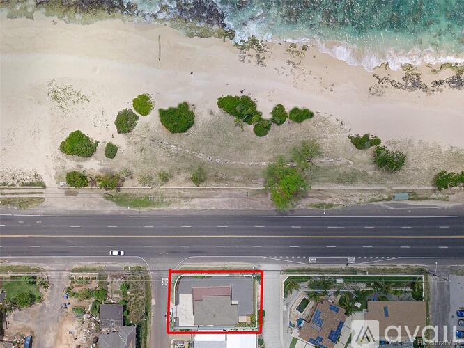 An aerial view of a beach with a red square highlighting a specific area.