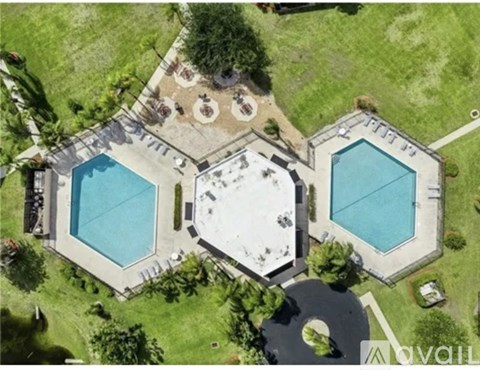 A large backyard with a pool and a patio area.