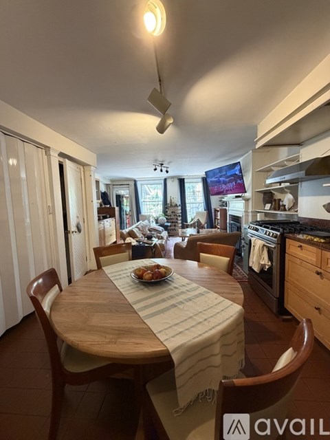 A kitchen with a table set for a meal.
