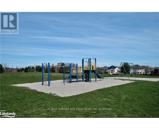A playground with a slide and swings in a park.