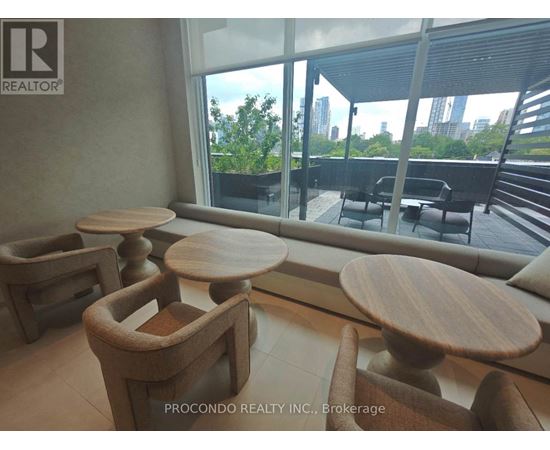 A room with wooden furniture and a view of the city.