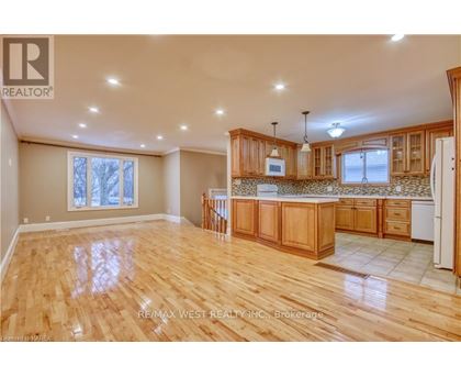A spacious kitchen with wooden cabinets and a central island.