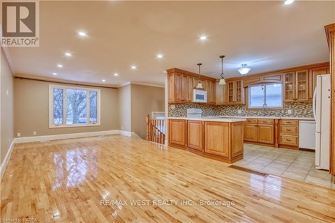 A spacious kitchen with wooden cabinets and a central island.