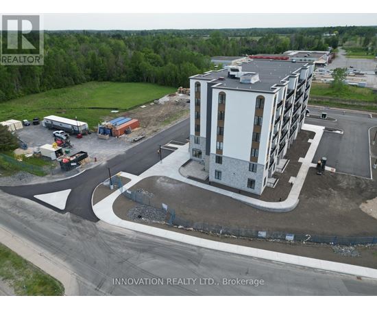 A building under construction with a sign that says Innovation Realty Ltd., Brokerage.