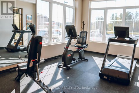 A gym with treadmills, exercise bikes, and elliptical machines.