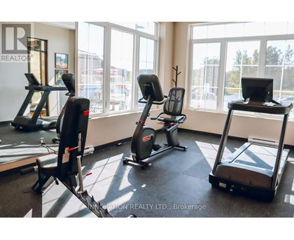 A gym with treadmills, exercise bikes, and elliptical machines.